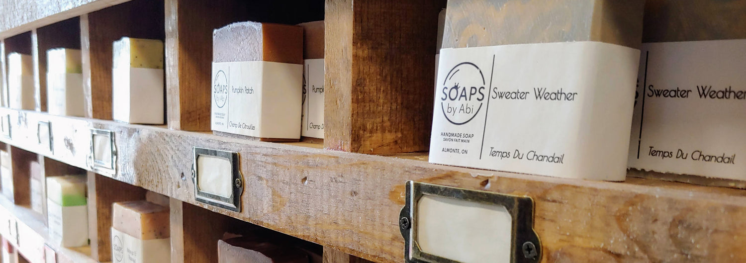 artisan soap bars on a vintage display soaps by abi almonte ontario